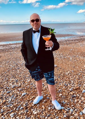Glenn Blackman celebrating the 2021 BMF Awards with a cocktail